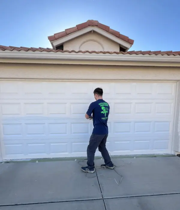 Garage door painting service technician