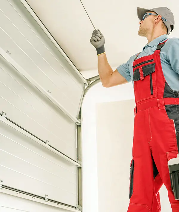 Garage door repair technician working