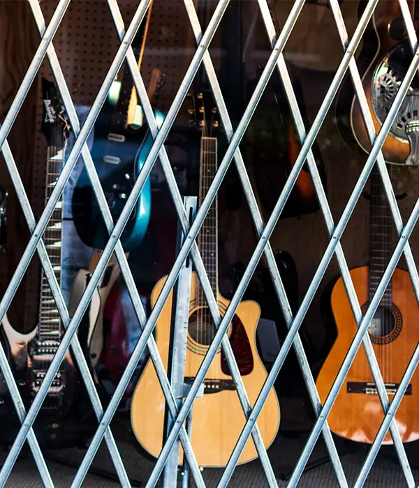 Guitars behind store security gate