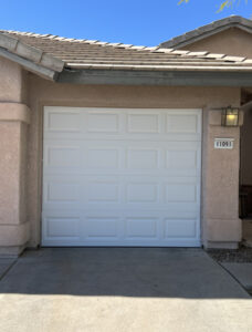 White garage door house exterior