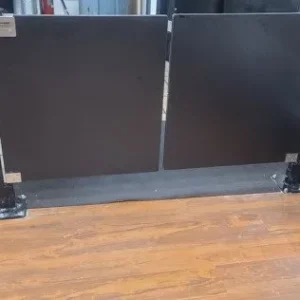 Metal security gate on floor
